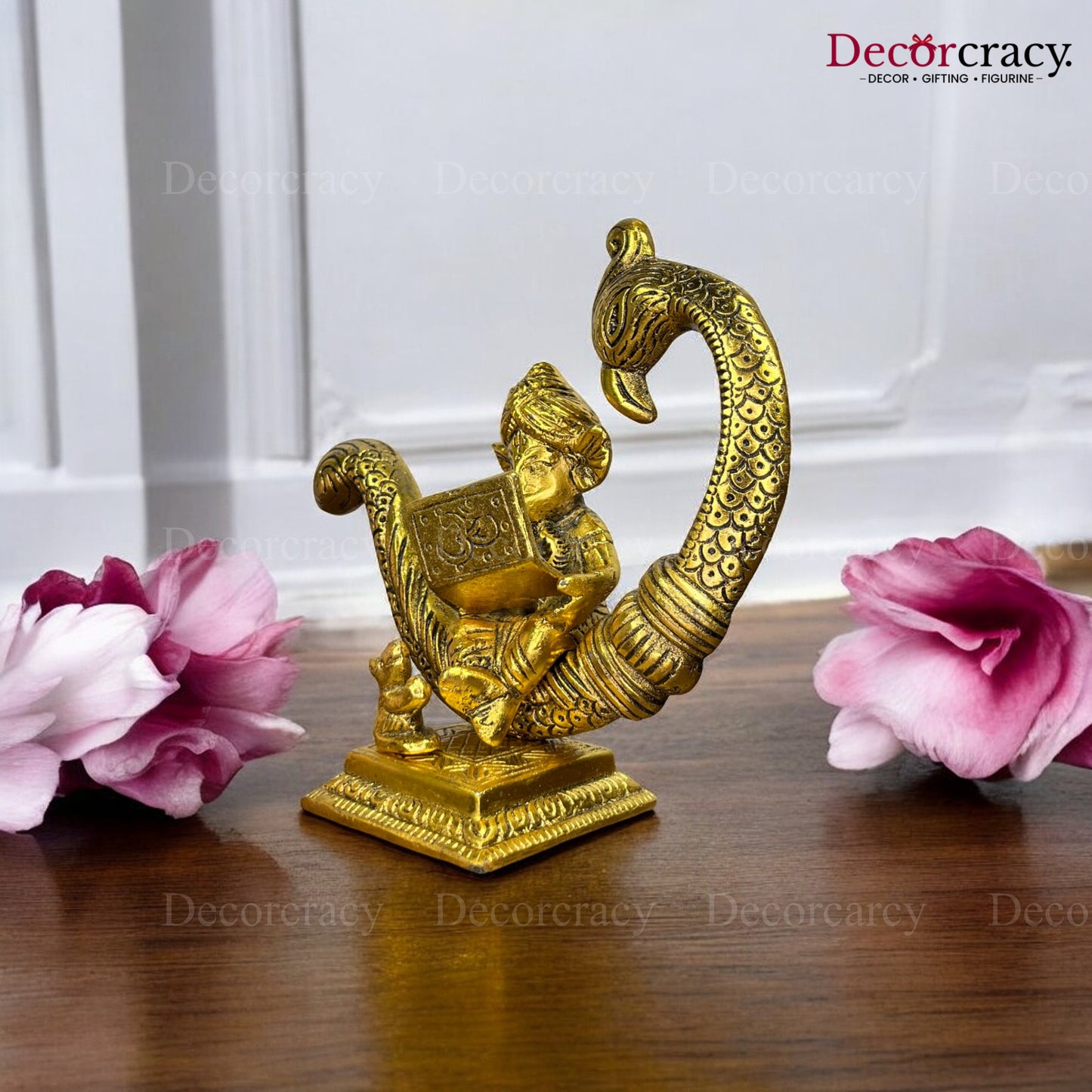 Ganesh sitting on Peacock & Reading Metal golden
