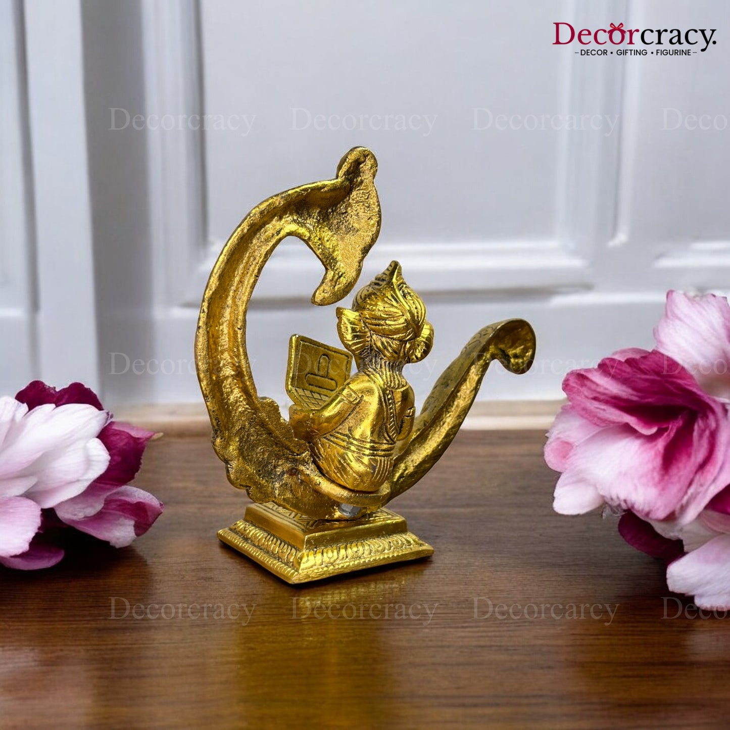Ganesh sitting on Peacock & Reading Metal golden